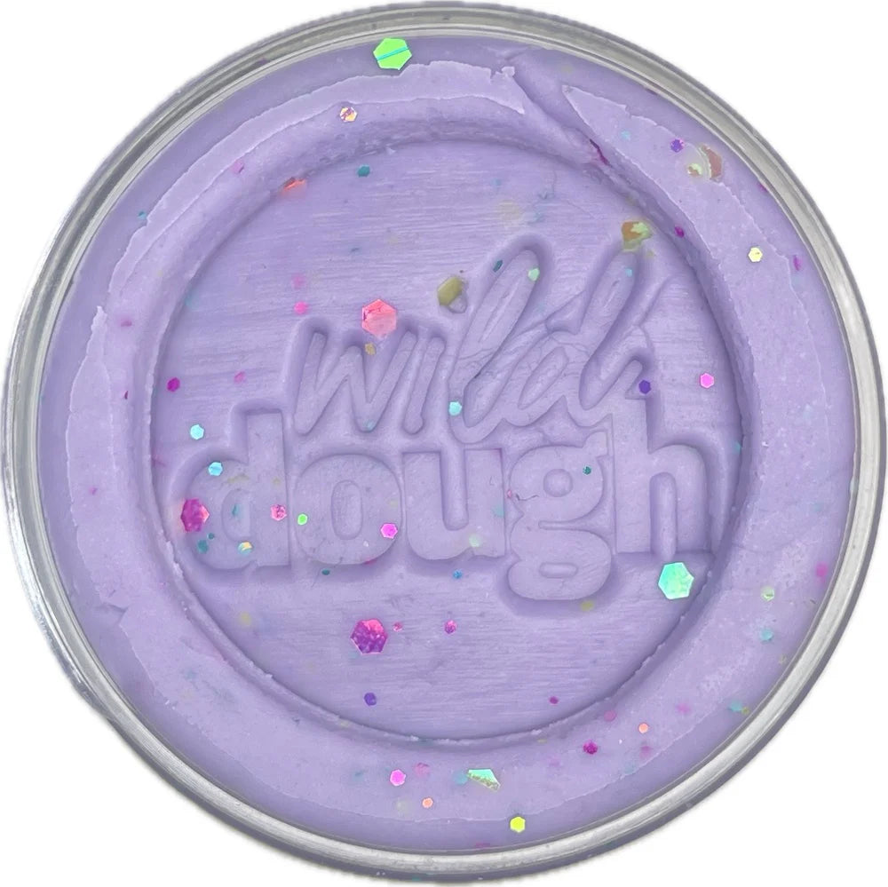 Purple dough with 'wild dough' text and colorful sprinkles on a white background