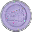 Purple dough with 'wild dough' text and colorful sprinkles on a white background