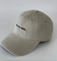 Beige cap with 'Hold My Beer' text on a white background