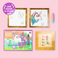 Magic painting set with framed art and a pen on a pink background