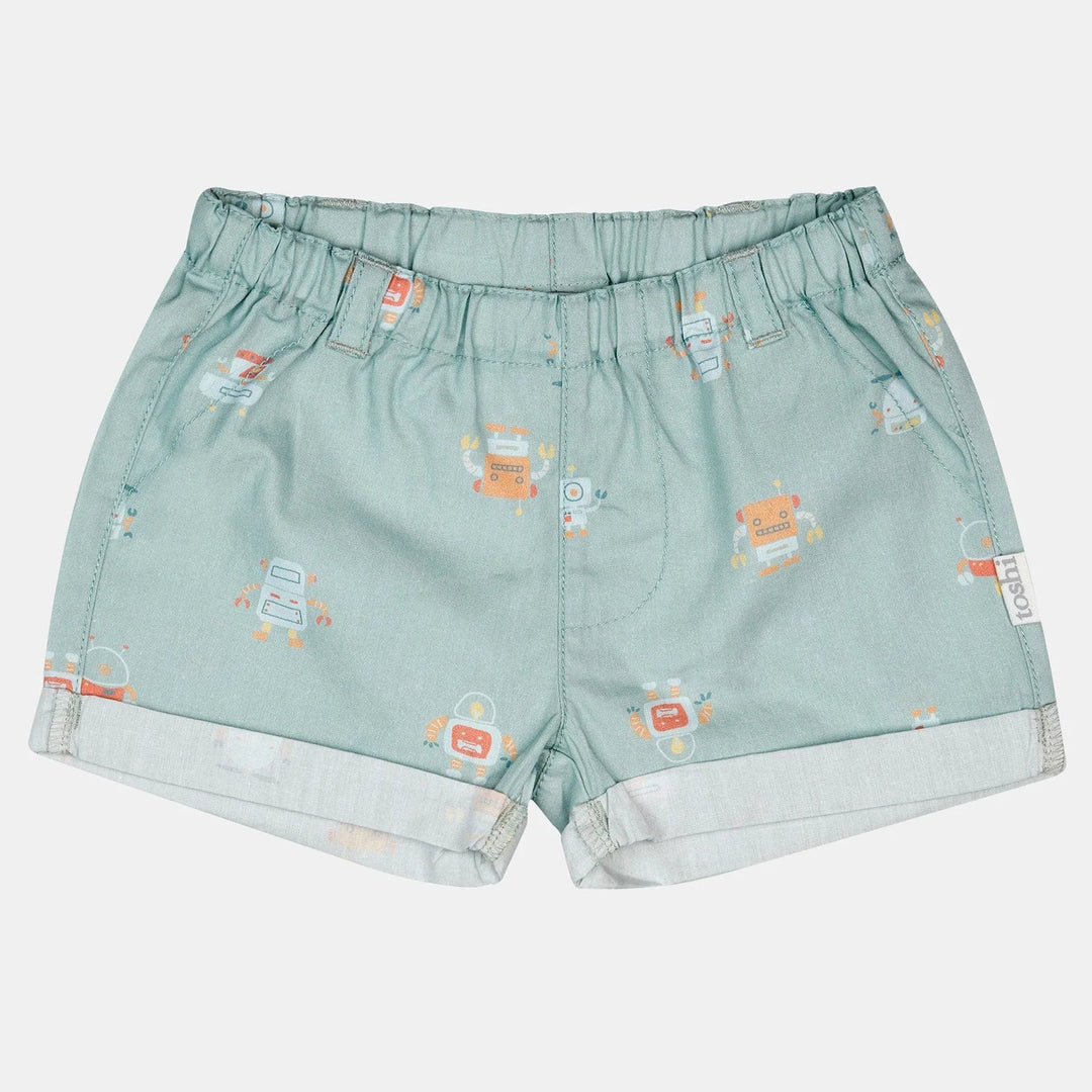 Light blue shorts with small graphic patterns on a white background