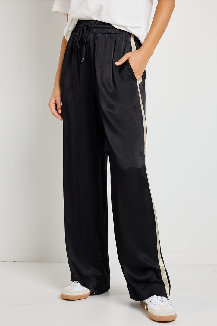 Upgrade your off-duty style with the Townie Black Satin Side Stripe Pants. Designed for ultimate comfort, available from www.thecollectivenz.com