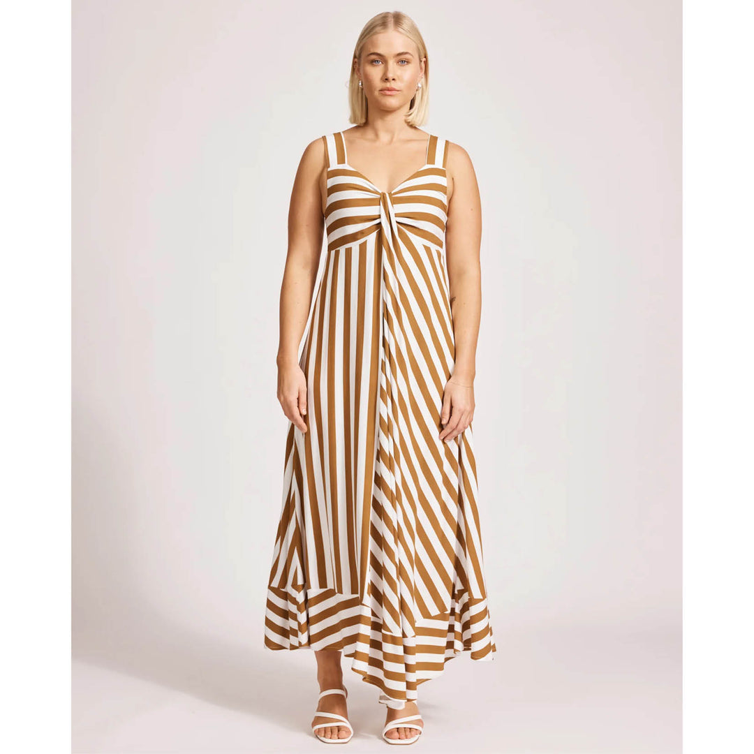 Woman wearing a eb & ive brown and white striped dress on a white background