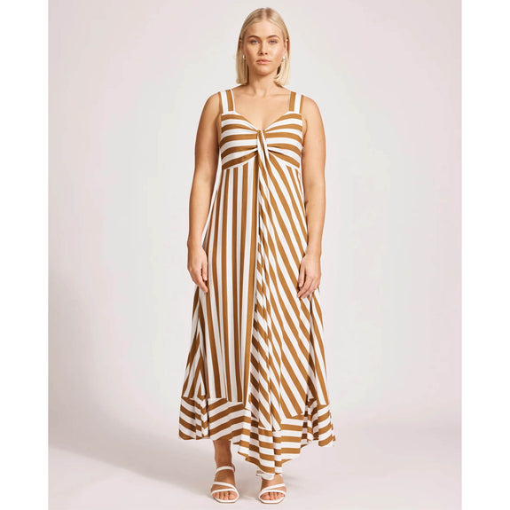 Woman wearing a eb & ive brown and white striped dress on a white background