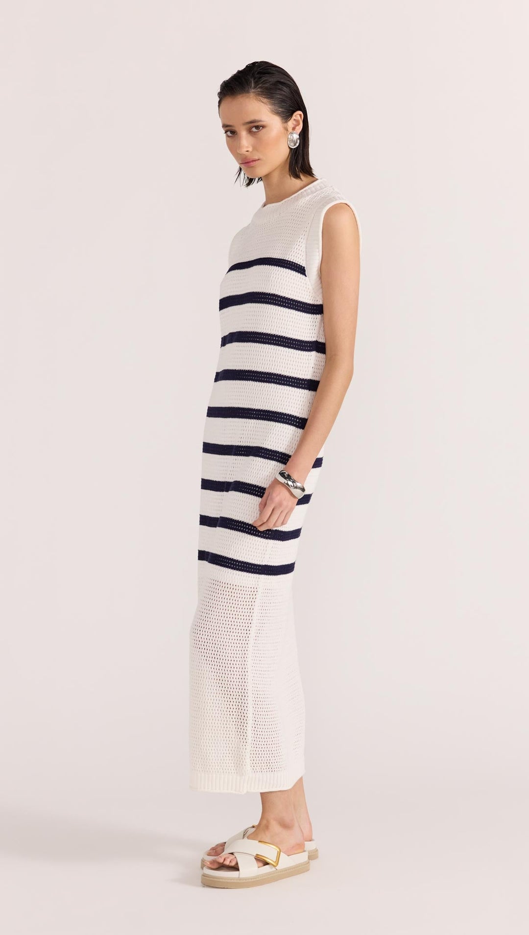 The Veda Stripe Midi Dress by Staple the Label features an open knit fabrication in 100% cotton, and a nautical white and navy striped pattern, available from www.thecollectivenz.com
