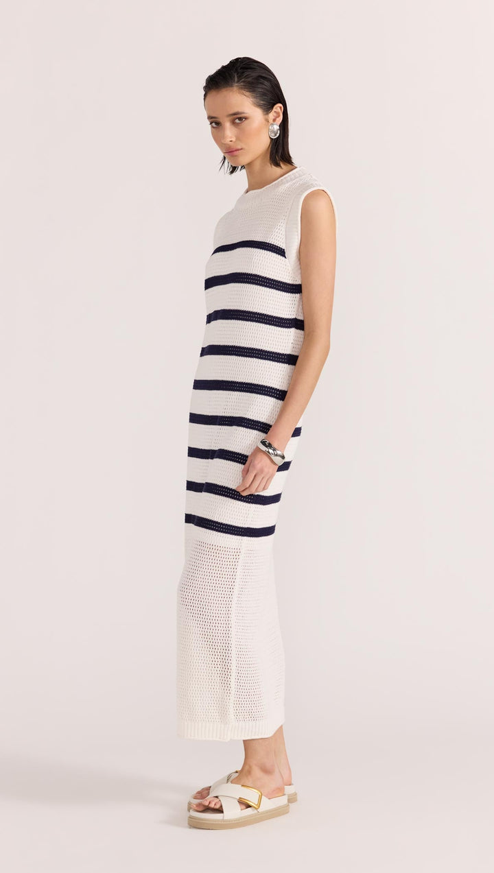 The Veda Stripe Midi Dress by Staple the Label features an open knit fabrication in 100% cotton, and a nautical white and navy striped pattern, available from www.thecollectivenz.com