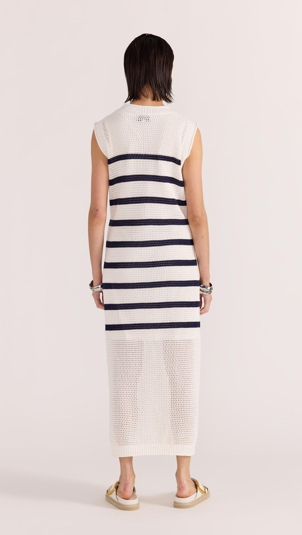 The Veda Stripe Midi Dress by Staple the Label features an open knit fabrication in 100% cotton, and a nautical white and navy striped pattern, available from www.thecollectivenz.com