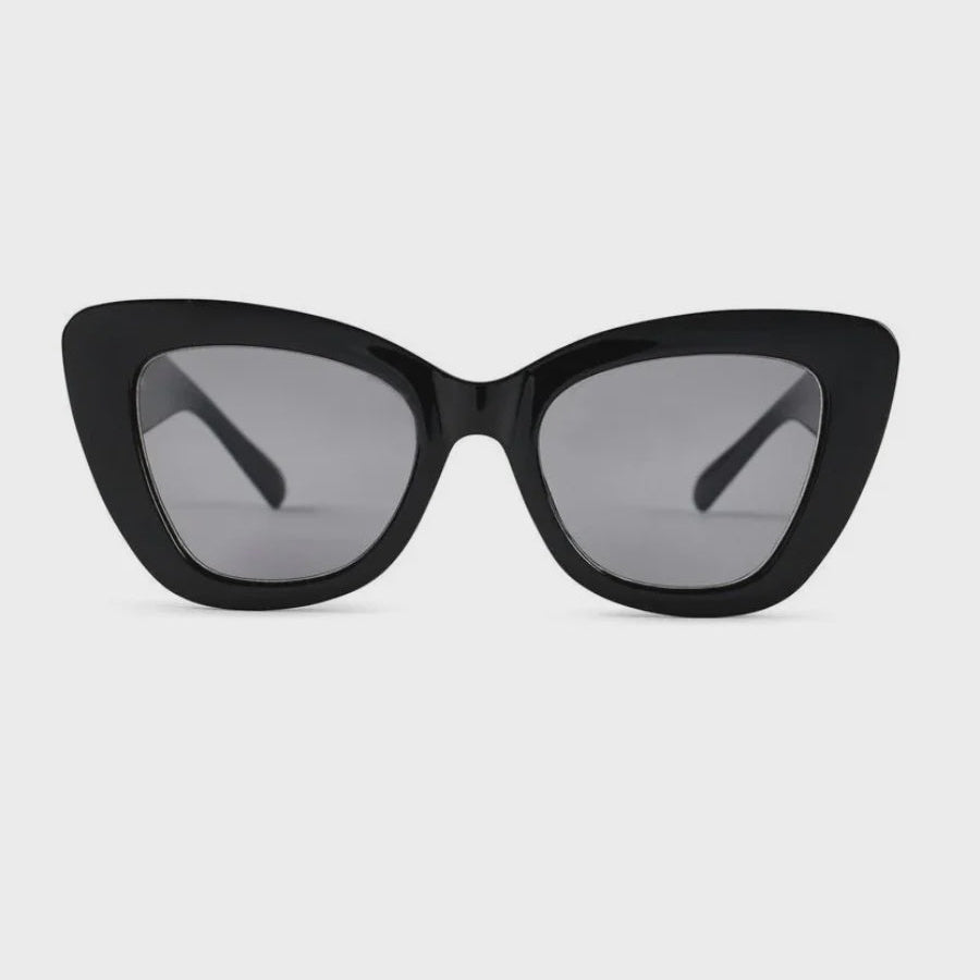 Black cat-eye sunglasses with dark gray tinted lenses, shown from the front on a light gray background.