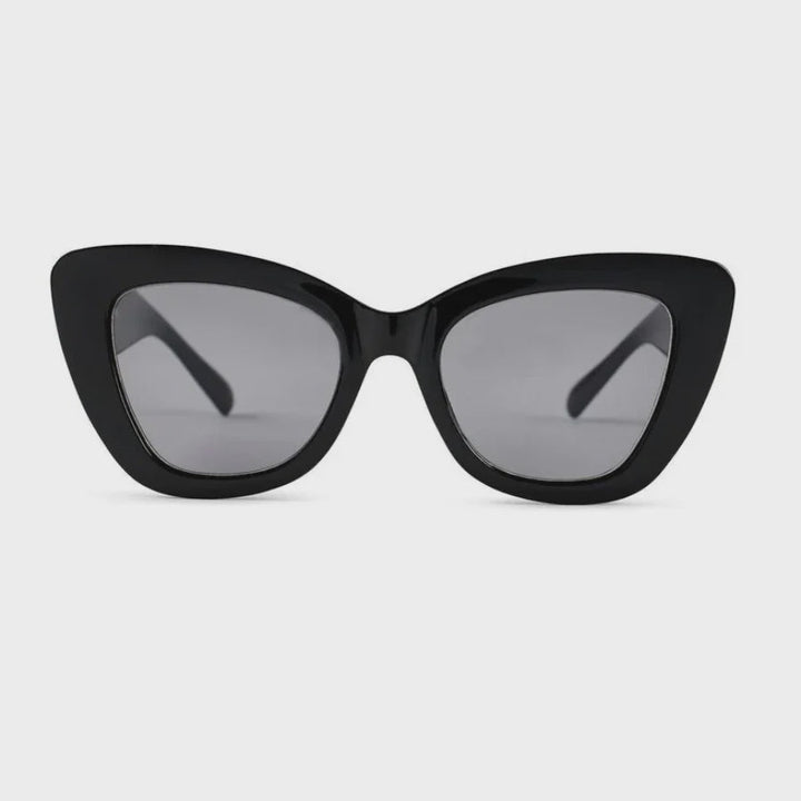 Black cat-eye sunglasses with dark gray tinted lenses, shown from the front on a light gray background.