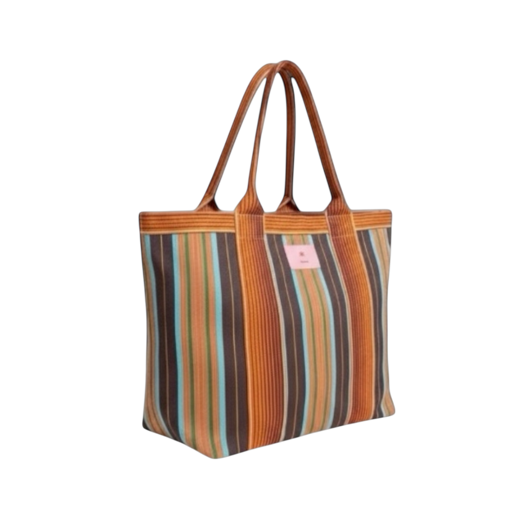 Striped tote bag with brown handles on a white background