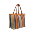Striped tote bag with brown handles on a white background