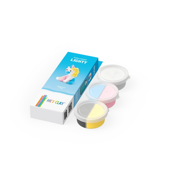 Set of colorful clay containers with packaging on a white background