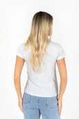Person wearing a white t-shirt and blue jeans on a white background