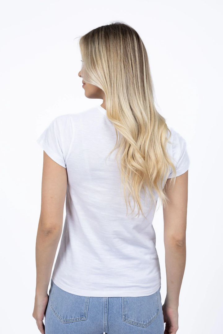 Woman wearing a plain white t-shirt and light blue jeans on a white background