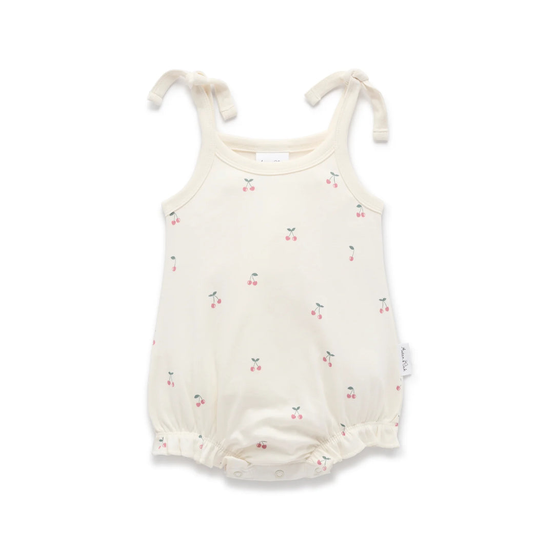 Baby romper with cherry pattern on a white background