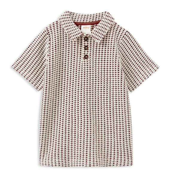 Checkered shirt with buttons on a white background
