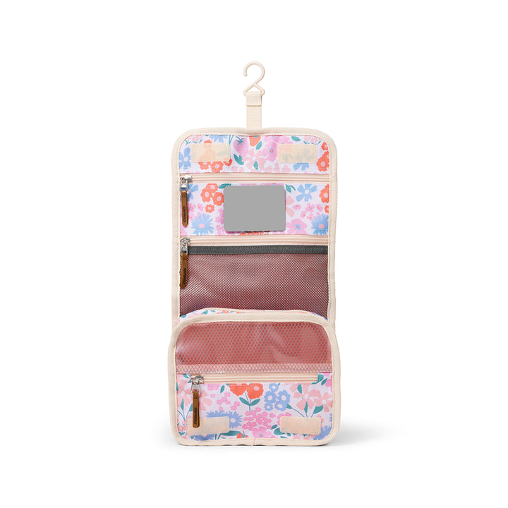 Floral-patterned hanging travel organizer on a white background