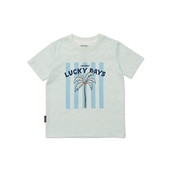 Light blue crywolf t-shirt with 'Lucky Days' graphic and palm tree design on a white background