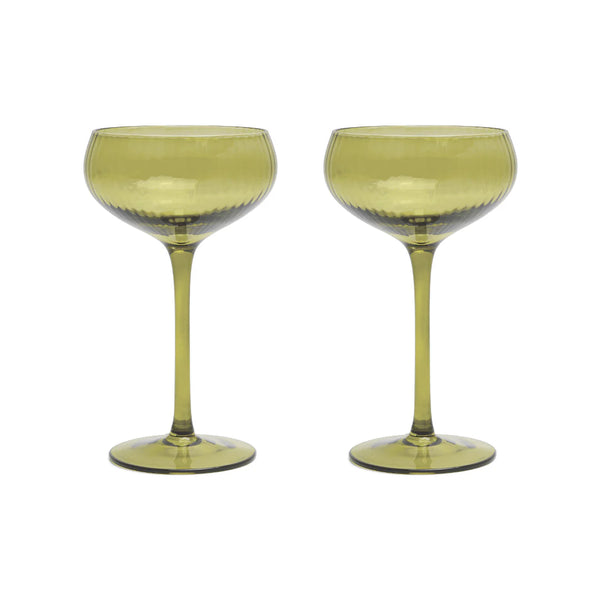Two green cocktail glasses on a white background