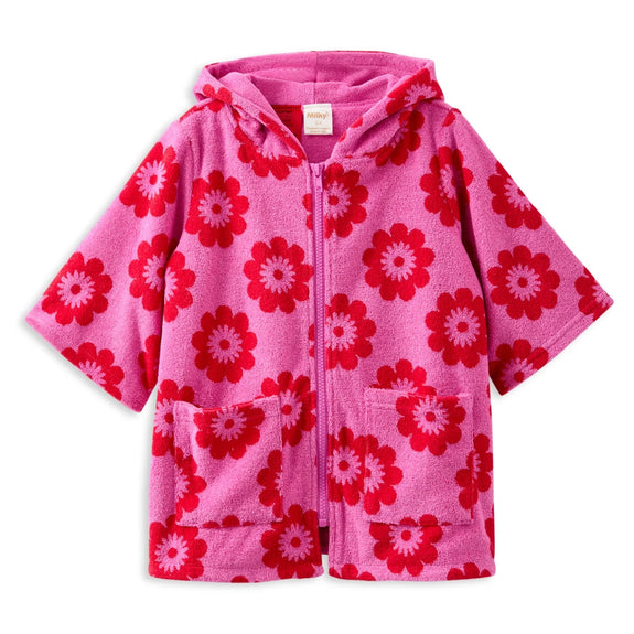 Pink children's towel with red floral pattern on a white background
