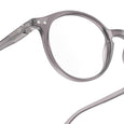 Close-up of a pair of gray eyeglasses on a white background