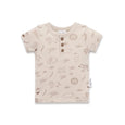 Beige baby t-shirt with animal prints on a white background