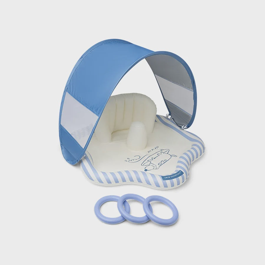 A baby sun canopy and bassinet attachment set in light blue and white, featuring a pop-up canopy, bassinet base with striped trim, and three matching blue rings on a light gray background.