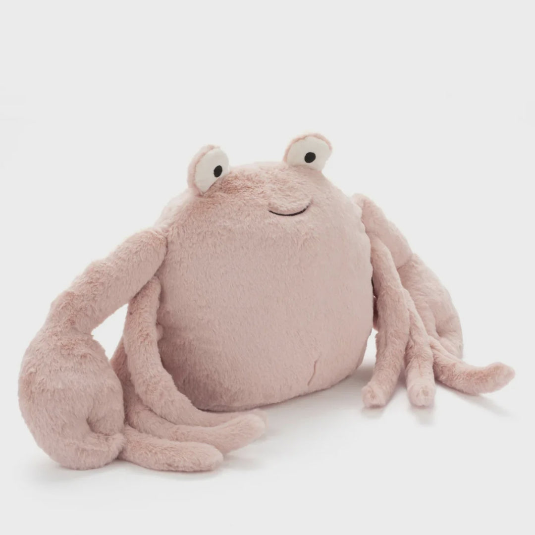 Pink plush crab toy on a white background
