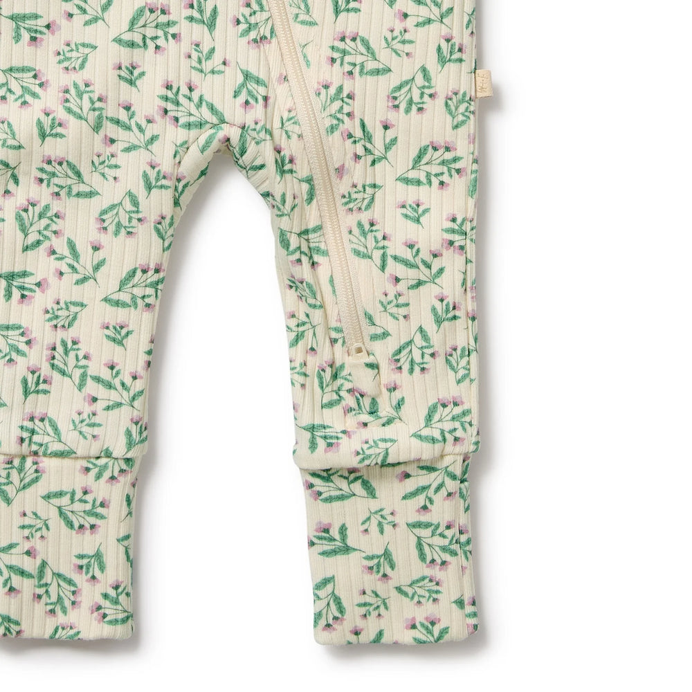 Floral-patterned baby romper on a white background