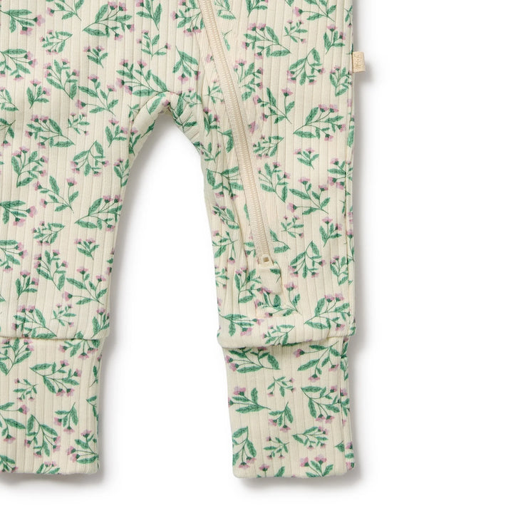 Floral-patterned baby romper on a white background
