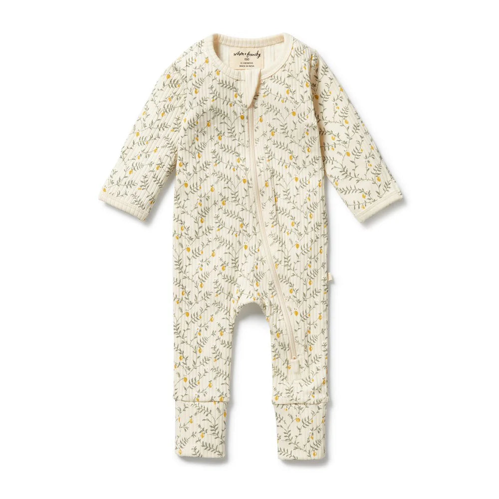Wilson & Frenchy Baby onesie with floral pattern on a white background
