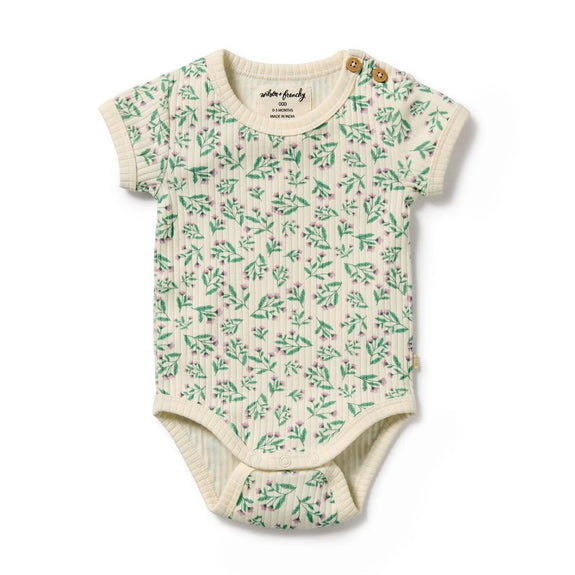 Baby onesie with green leaf pattern on a white background