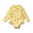 Wilson & Frenchy Yellow baby onesie with lemon pattern on a white background
