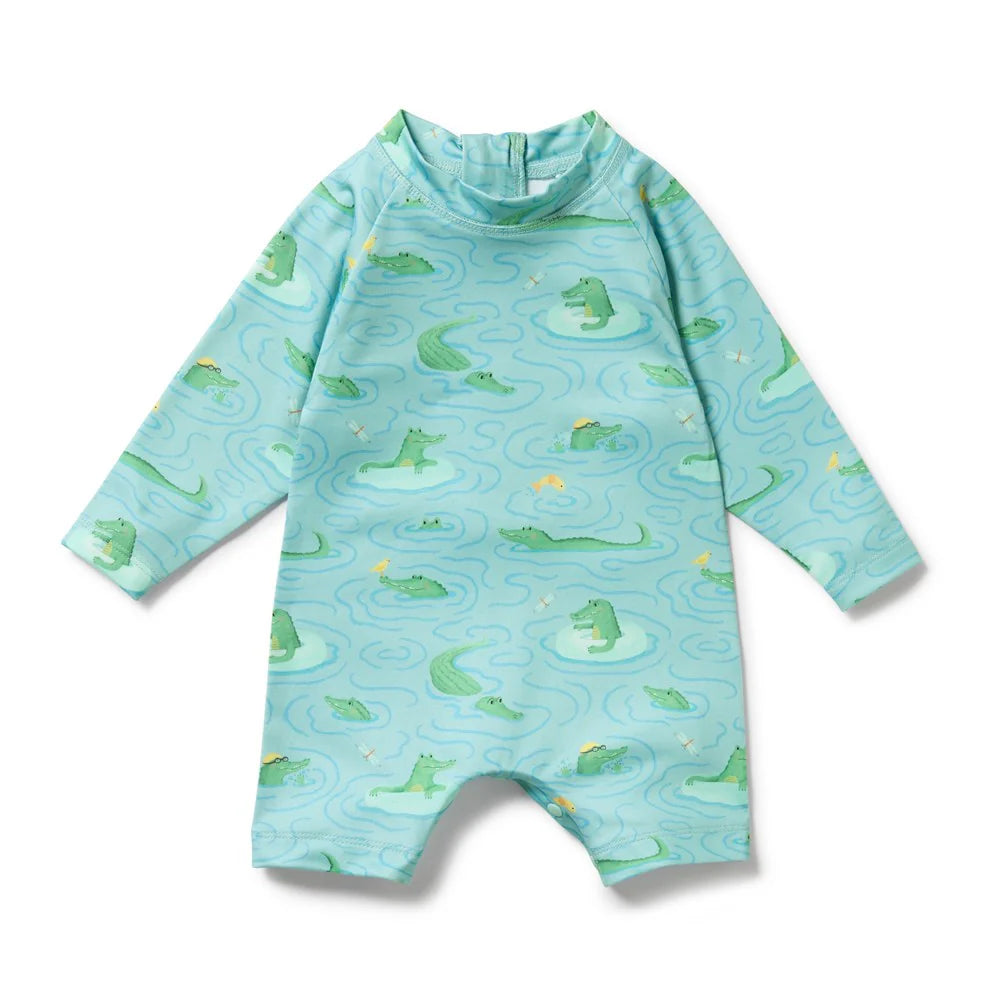 Children's Wilson & Frenchy swimsuit with alligator pattern on a light blue background