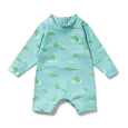 Children's Wilson & Frenchy swimsuit with alligator pattern on a light blue background