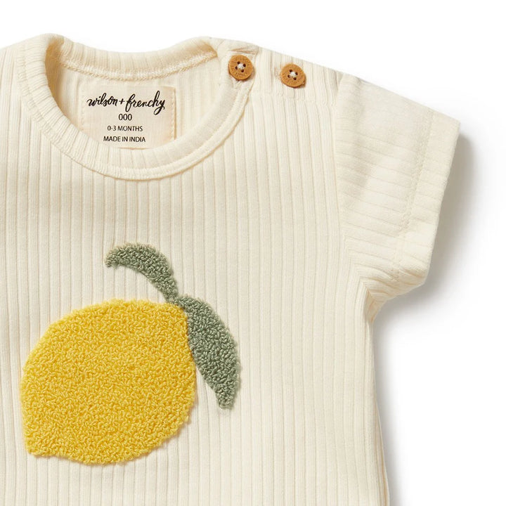 Wilson & frenchy Baby shirt with lemon design and brand label on a white background