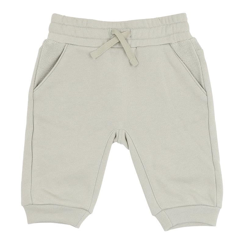 Beige sweatpants with a drawstring on a white background