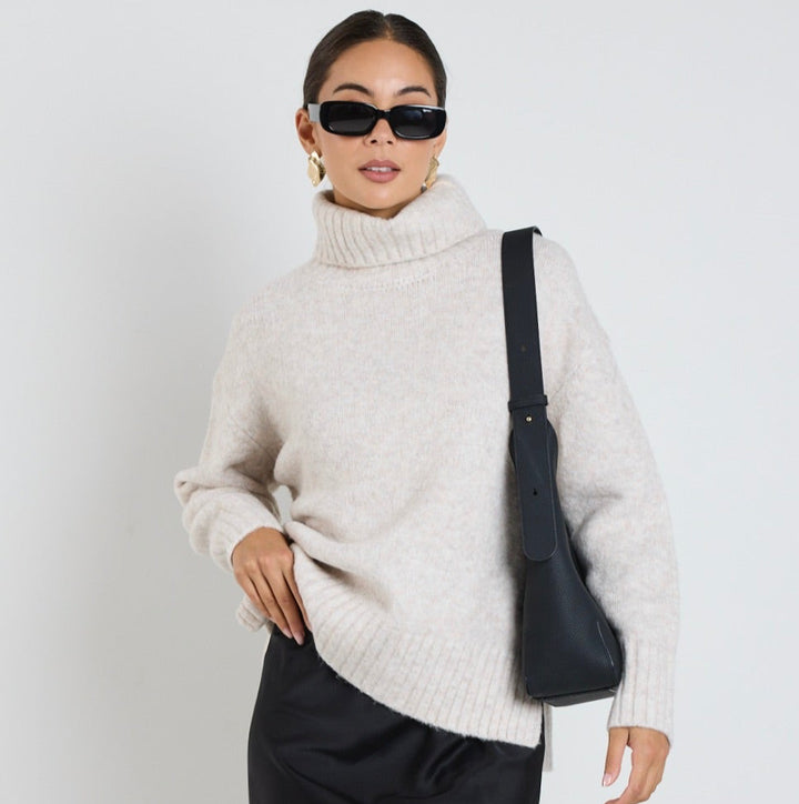 The Zealous knit features a roll neckline and ultra-soft chunky knit fabric that you'll love to wear again and again. Available from www.thecollectivenz.com