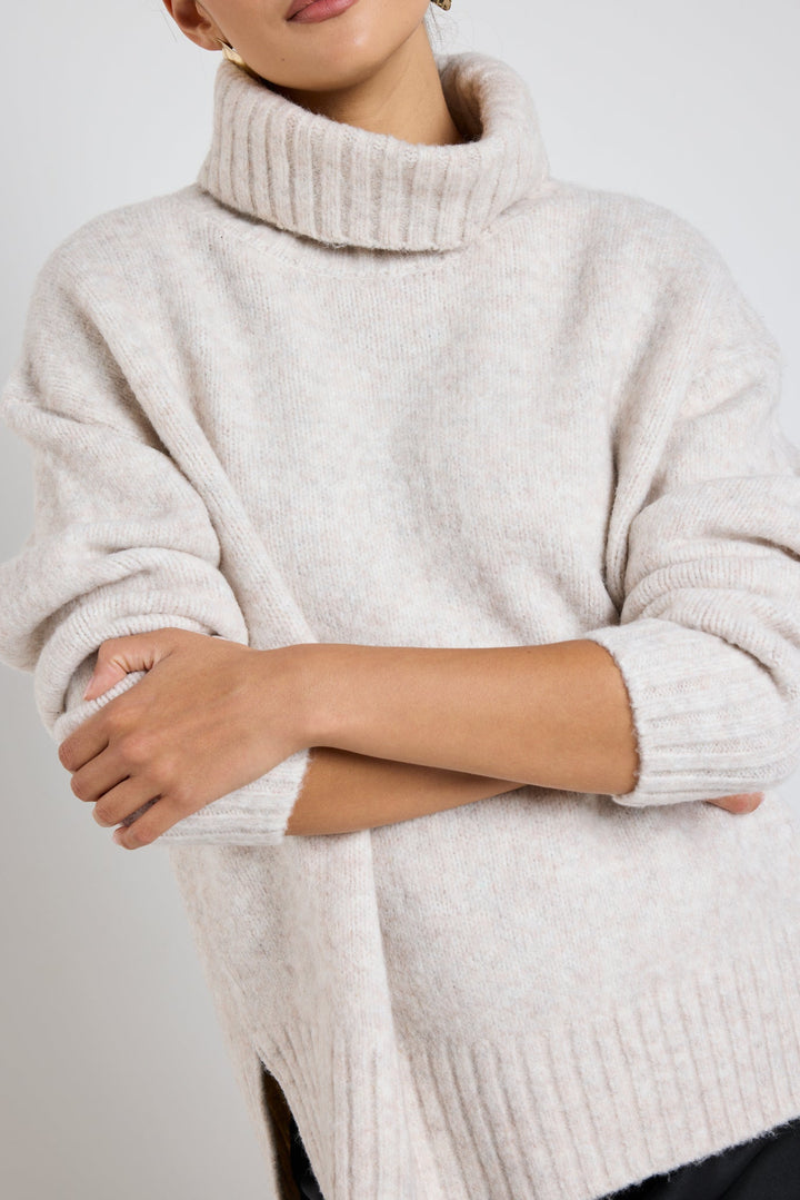 The Zealous knit features a roll neckline and ultra-soft chunky knit fabric that you'll love to wear again and again. Available from www.thecollectivenz.com