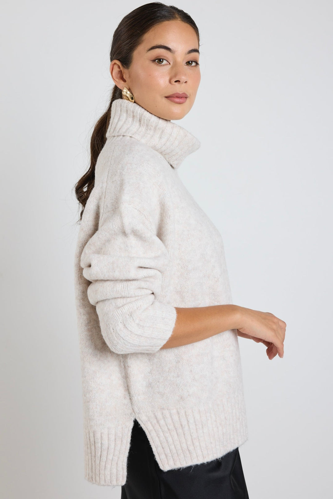 The Zealous knit features a roll neckline and ultra-soft chunky knit fabric that you'll love to wear again and again. Available from www.thecollectivenz.com