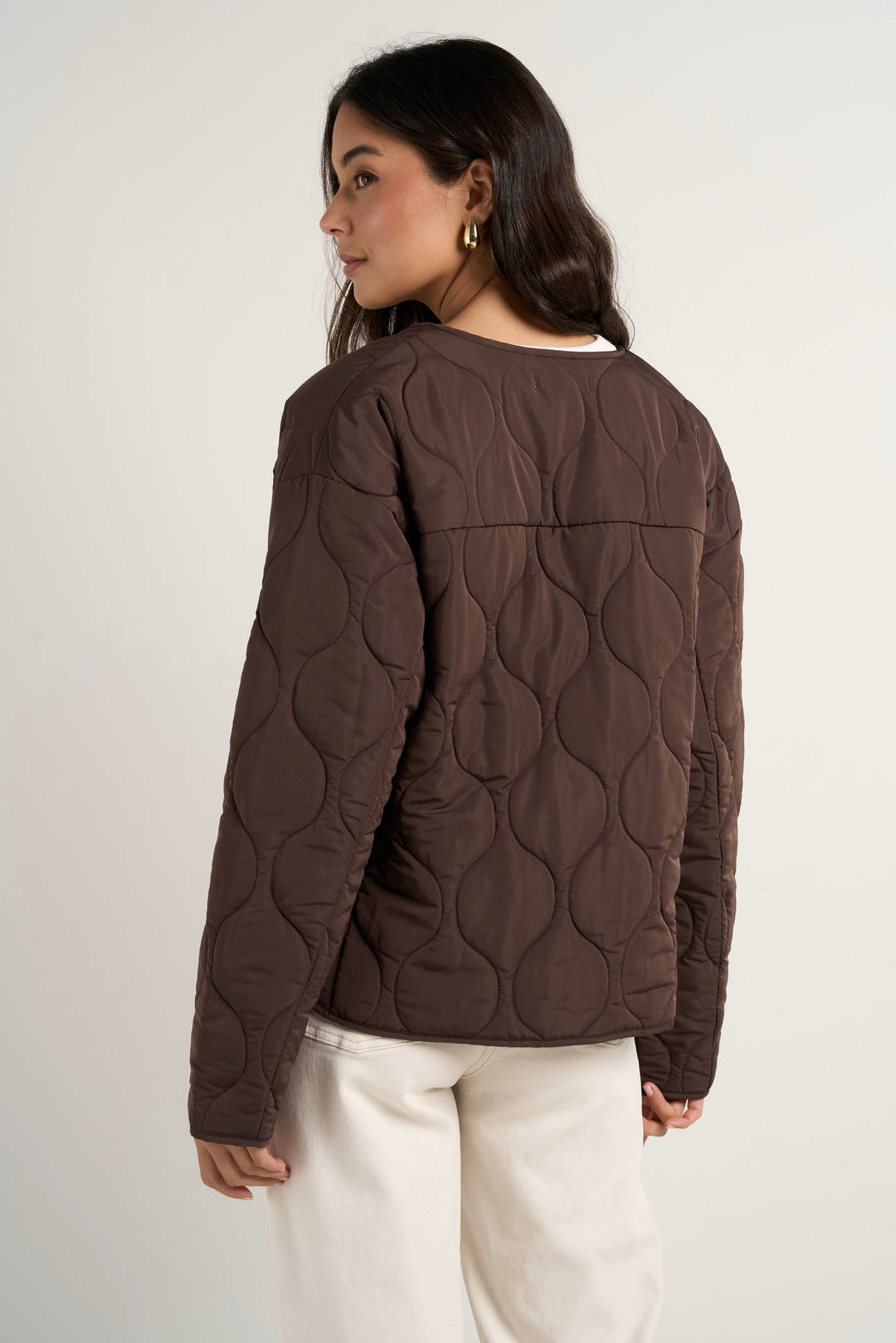 Stay cosy while keeping effortlessly chic in this chocolate quilted puffer jacket. With its lightweight yet warm design, this is the perfect layering piece to transition through the seasons. Available from www.thecollectivenz.com