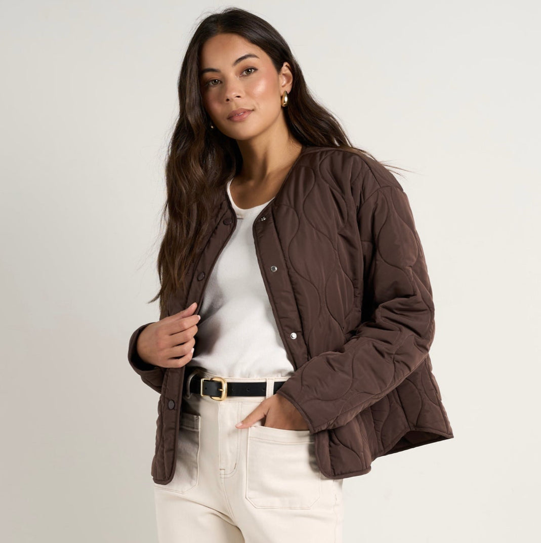 Stay cosy while keeping effortlessly chic in this chocolate quilted puffer jacket. With its lightweight yet warm design, this is the perfect layering piece to transition through the seasons. Available from www.thecollectivenz.com