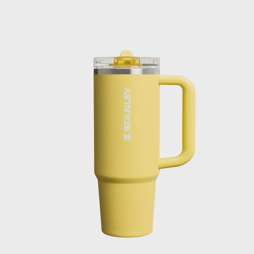 Yellow Stanley travel mug on a white background