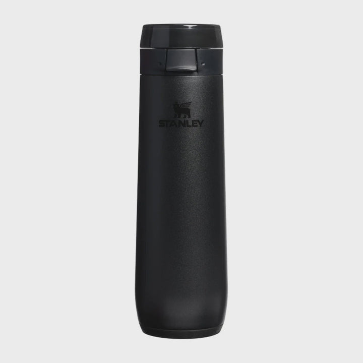 A black Stanley travel tumbler with a matching black lid, shown vertically against a light gray background.