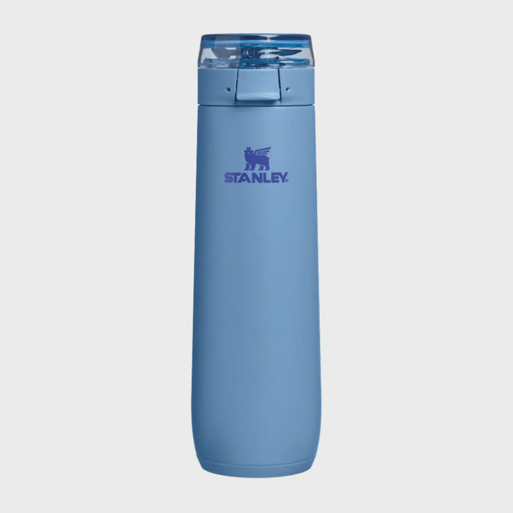 A light blue Stanley water bottle with a matching blue lid, centered on a light gray background.