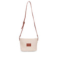 Beige handbag with a brown strap on a white background