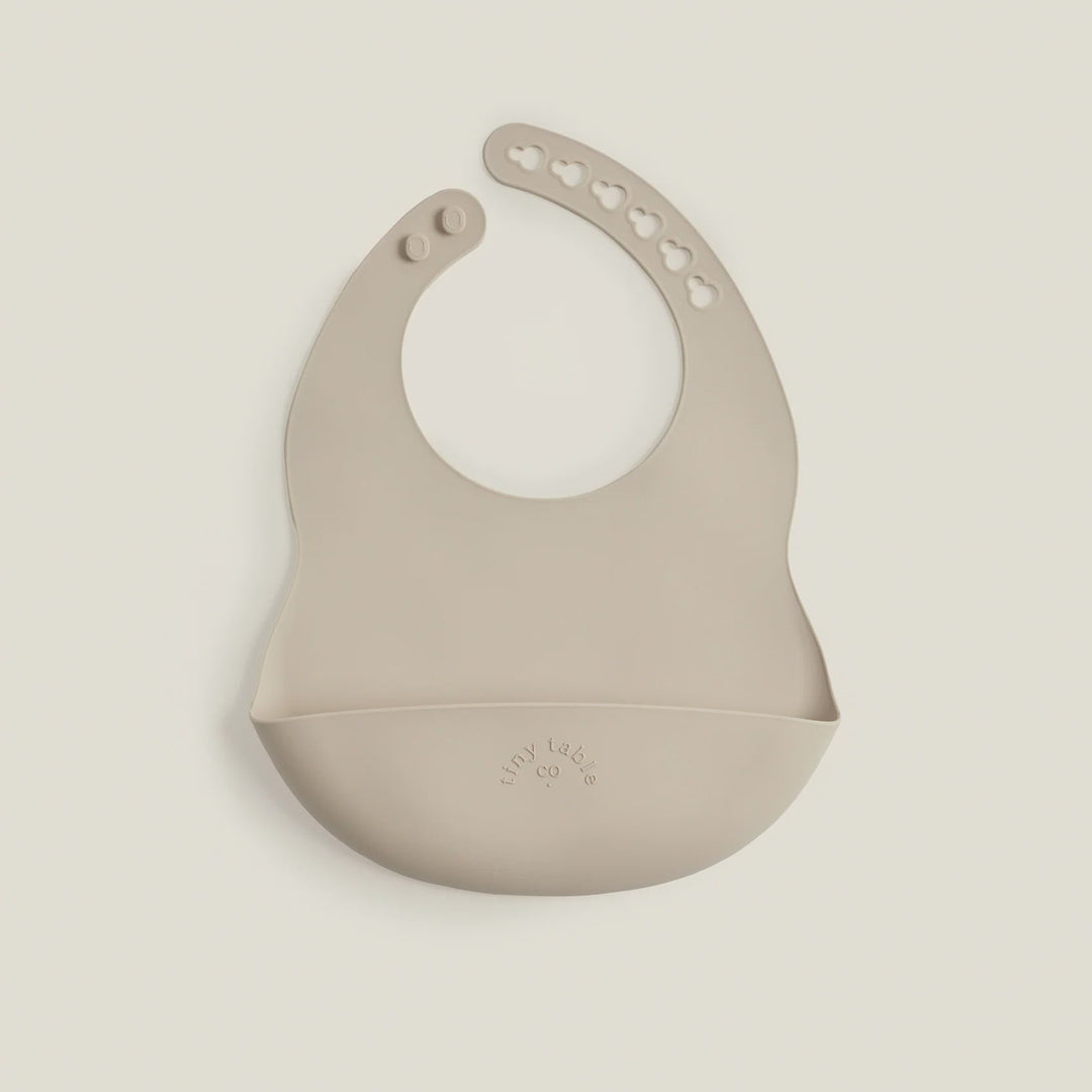 Beige silicone bib on a beige background