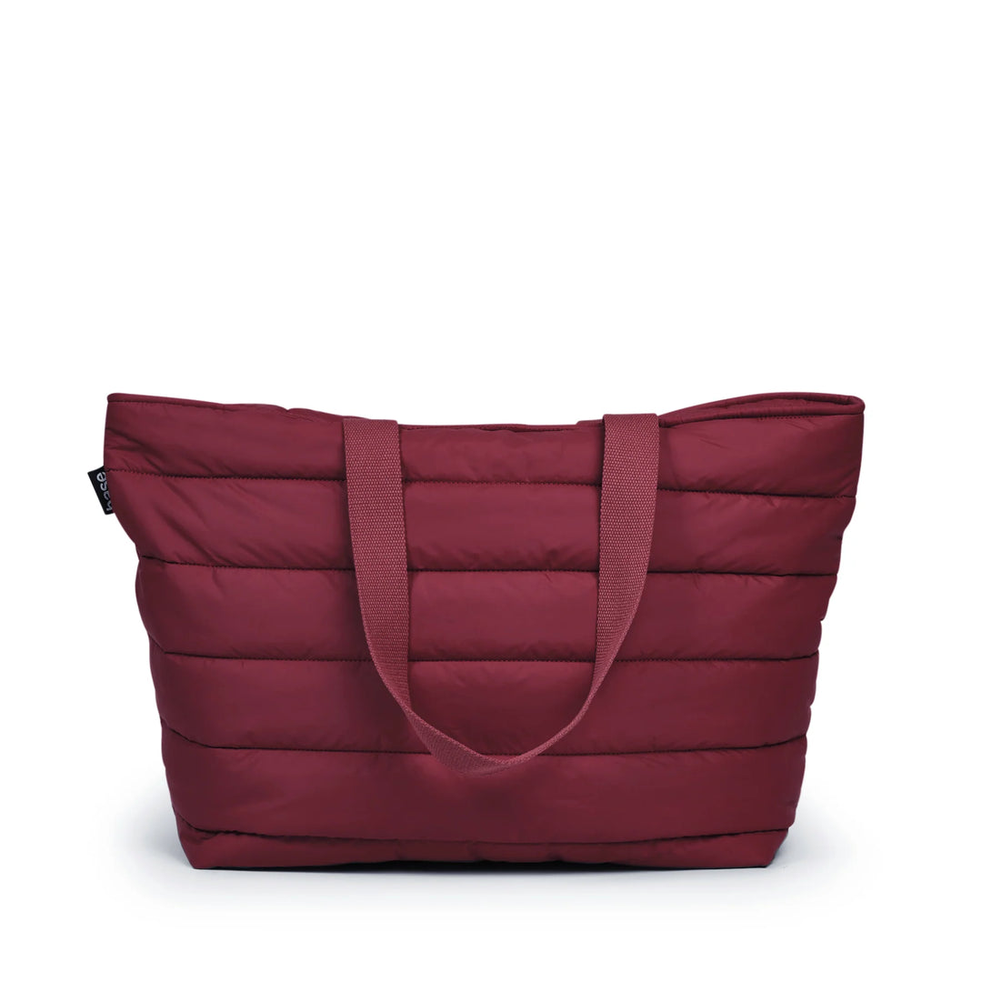 Maroon quilted tote bag on a white background