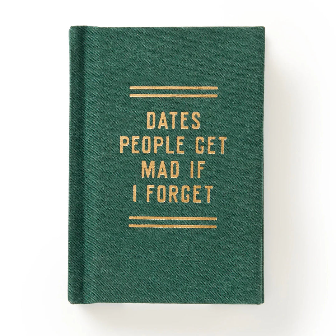 Green notebook with gold text on a white background