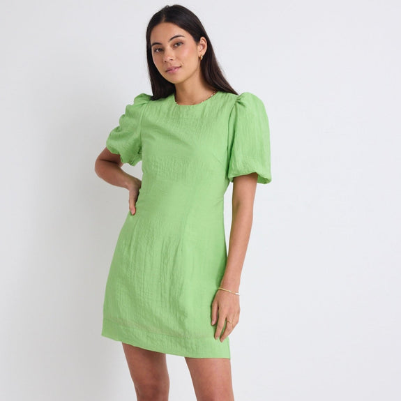 Feel ultra chic in the Emory apple green mini dress from Stories be Told, available from www.thecollectivenz.com